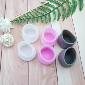 Detailed view of assorted silicone chair leg floor protectors in white, pink and dark grey.