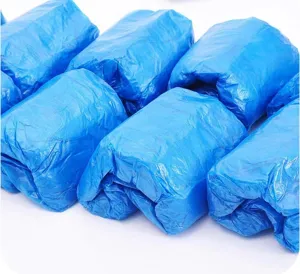 Copriscarpe monouso in plastica PE blu ispessita, impermeabile antipolvere vista dettaglio.