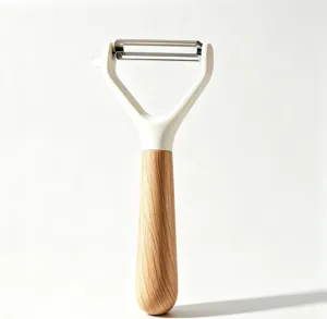 Stainless steel kitchen fruit peeler with wooden handle detail view, sharp double blade.
