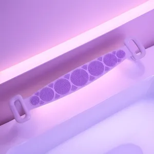 Close-up view of the purple silicone bath back scrubber showcasing its textured massage nodes.
