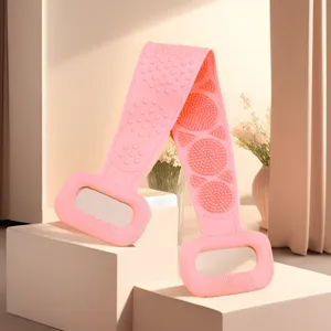 Pink silicone bath back scrubber strap detail, soft massage bristles for body exfoliating.