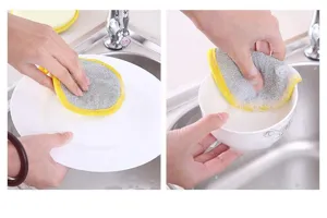 Round double-sided dishwashing sponge detail view showing efficient cleaning performance on plates.
