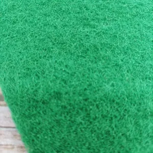 Dettaglio del materiale della spugna abrasiva verde, primo piano della texture cucina.