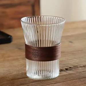Ribbed glass drinking cup with wooden sleeve, high borosilicate heat-resistant coffee and tea cup.