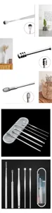 Stainless steel ear pick detail shot, showing precision spiral tips and portable storage case.