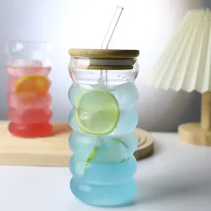 Clear glass straw cup with bamboo lid, ribbed design tumbler for juice, milk, and daily use.