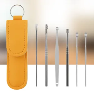 Stainless steel ear pick set with portable yellow leather case for daily ear cleaning tools.