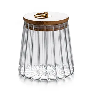Clear glass storage jar with bamboo lid and gold ring, perfect for kitchen pantry organization.