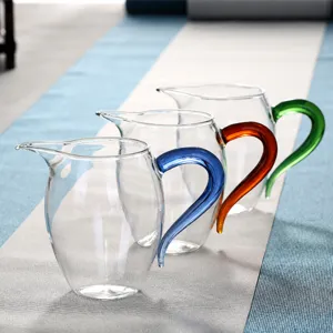 Thickened heat-resistant glass fair cup, transparent tea pitcher with colorful handle for kung fu tea.