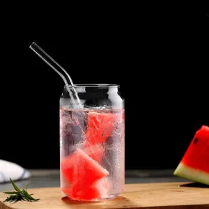 Clear glass can shaped cola cup with straw for juice and beverages, elegant drinkware.
