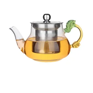 Théière en verre résistant à la chaleur avec infuseur inox et poignée dragon pour thé.