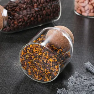 Clear glass storage jar with round cork lid, perfect kitchen container for tea beans and dry food.