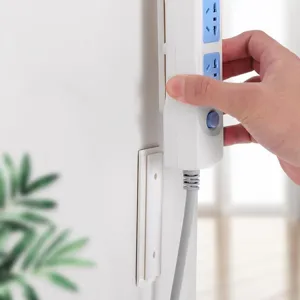 Wall-mounted power strip holder punch-free socket fixator traceless wall sticker rack