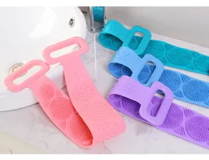Detail view of colorful silicone back scrubbers and bath brushes for body massage.