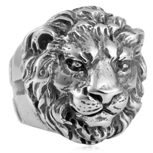 Close-up detail of vintage stainless steel lion head ring for men, punk biker jewelry design.