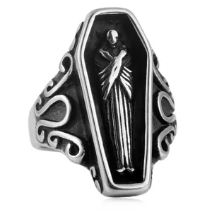 Details of vintage titanium steel coffin skeleton ring, gothic punk style jewelry close up.