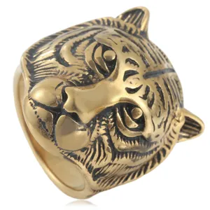 Close-up view of the detailed gold tiger head ring showcasing intricate engraved patterns.