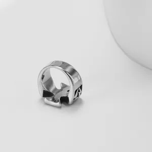 Close-up detail shot of a titanium steel gothic cross ring featuring polished finish.