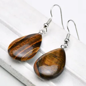 Natural tiger eye gemstone teardrop earrings with silver hooks, elegant daily jewelry detail.