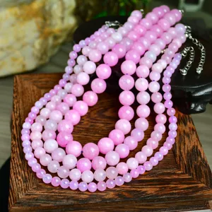 Detailed view of pink gemstone beaded necklace, stylish natural quartz choker for women.