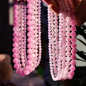 Purple kunzite gemstone bead necklace detail, natural stone jewelry accessory for women.