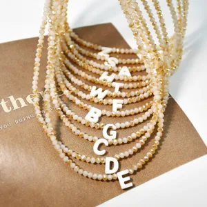 Collana girocollo con perline di cristallo e ciondolo lettera iniziale donna estate