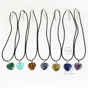Natural stone heart pendant necklace set with black leather cord, perfect fashion gift detail.