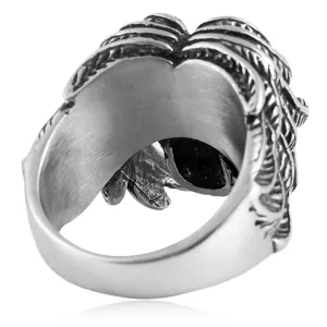 Titanium steel skull ring with wings detail, retro gothic punk style men's jewelry accessory.