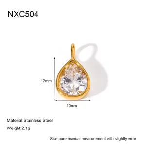 Close-up detail of the gold teardrop zircon pendant, showing exquisite metal edging and crystal.