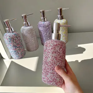 Detail view of a creative rhinestone soap dispenser bottle with a pump, sparkly and elegant.