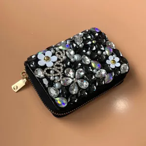 Rhinestone crystal black wallet card holder with sparkling bow and flower design for women.