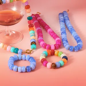 Bohemian colorful acrylic beaded jewelry set featuring layered necklaces and matching bracelets.