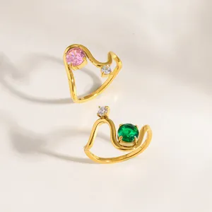 Gold plated stainless steel wavy rings with pink and green zirconia stones for elegant daily wear.