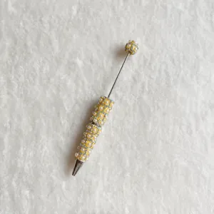 Yellow pearl rhinestone beaded pen DIY craft tool decorative shiny ballpoint pen detail view