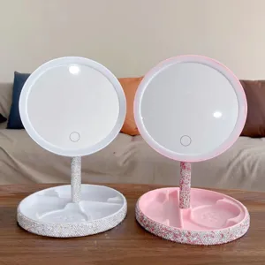 Detail view of LED makeup mirror with dazzling rhinestones, touch control light and tray base.