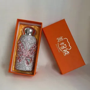 Rhinestone thermos cup with butterfly design and mushroom cap in luxury orange gift box.