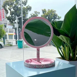 LED lighted makeup mirror with rhinestone stand and storage tray base, cosmetic vanity mirror detail.