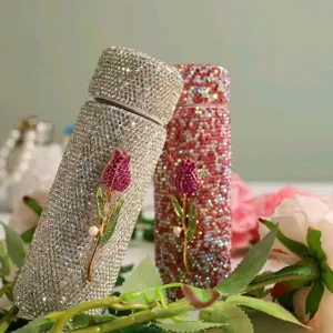 Close-up detail of rhinestone insulated pocket cup with sparkling crystal and floral decor.