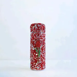 Close-up detail of the portable rhinestone-encrusted mini pocket thermos cup surface texture.