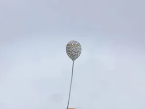 Close up detail of a sparkling rhinestone balloon car vent clip ornament decoration.