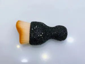 Detailed view of dense soft bristles and sparkling black rhinestone handle design.