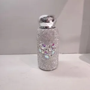 Close-up of the sparkling rhinestone insulated water bottle detail with crystal heart design.