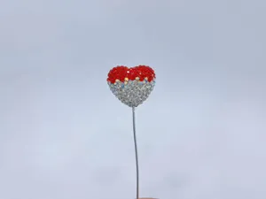 Rhinestone heart balloon car ornament detail, sparkling crystal interior decor piece.