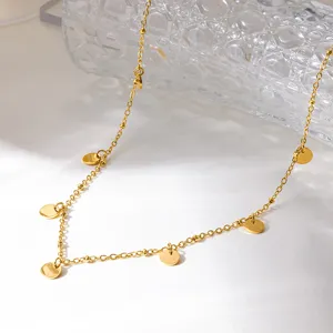 Gold-plated stainless steel round disc pendant necklace detail, elegant fashion jewelry.
