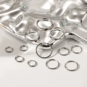 Minimalist stainless steel hoop earrings detail, highly polished silver circle earrings set.