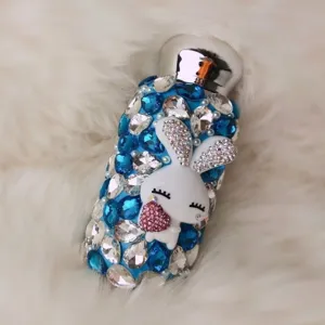 Bling rhinestone insulated thermos water bottle with cute bunny and sparkling blue crystals.