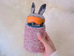 Detailed view of the luxury rhinestone rabbit ear thermos cup, portable stainless steel flask.
