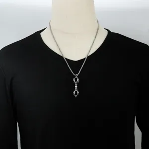 Punk retro stainless steel hollow vajra pestle pendant necklace for men and women daily wear.