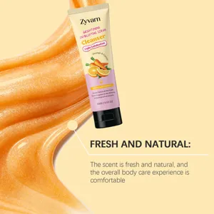 Detailed close-up of orange exfoliating scrub texture and product packaging with fresh fragrance.