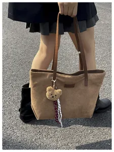 Brown suede tote bag with cute bear pendant, large capacity casual commuting handbag for women.